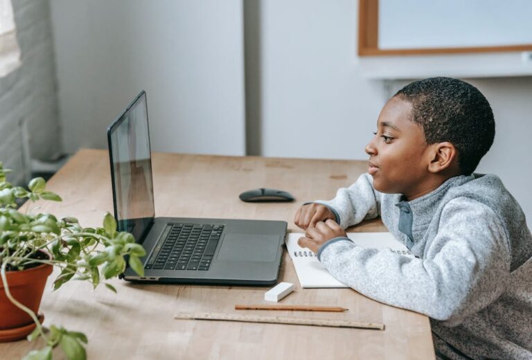 young boy on laptop for class