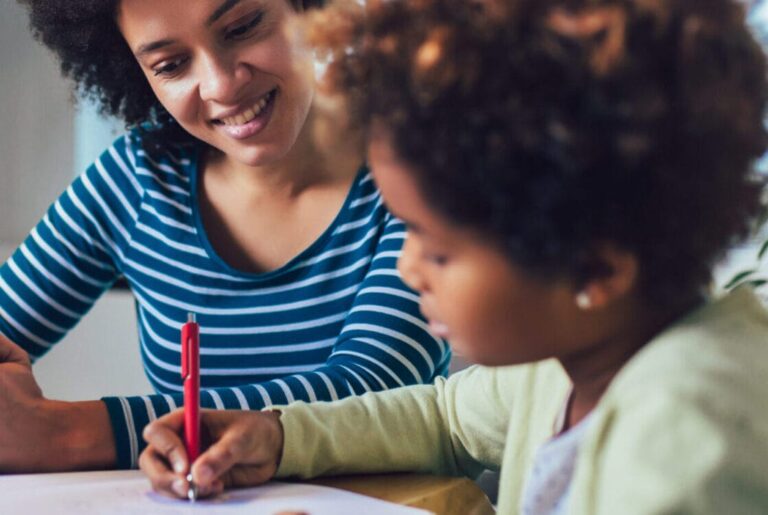 mom helping child with homework