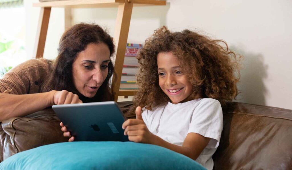 mom and daughter on tablet