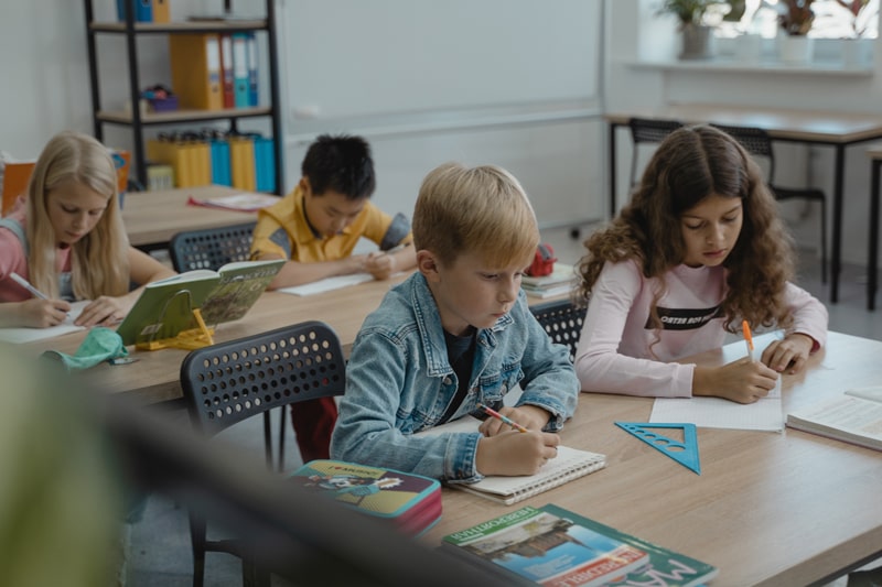 children studying in a classroom