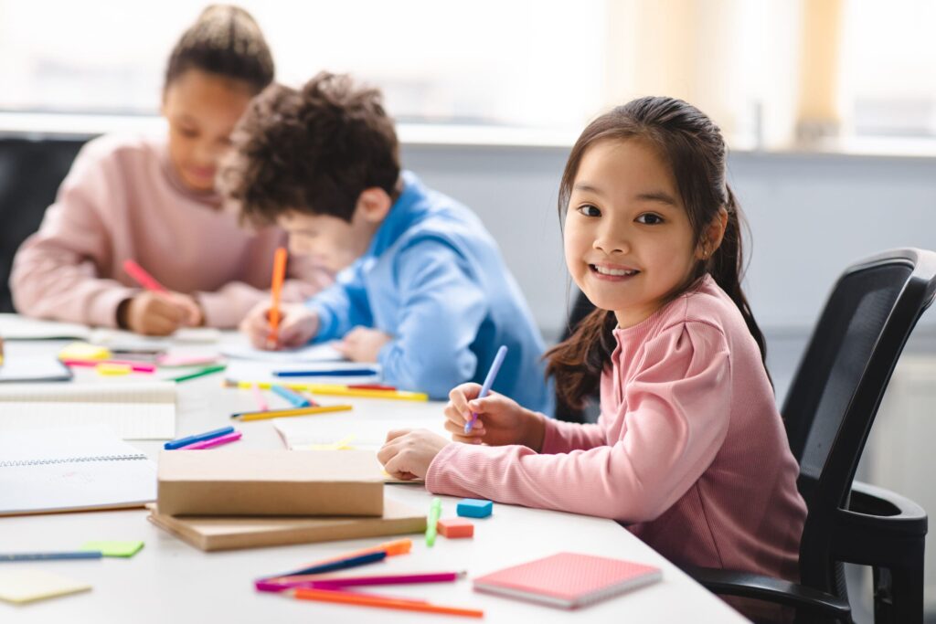 smiling girl coloring