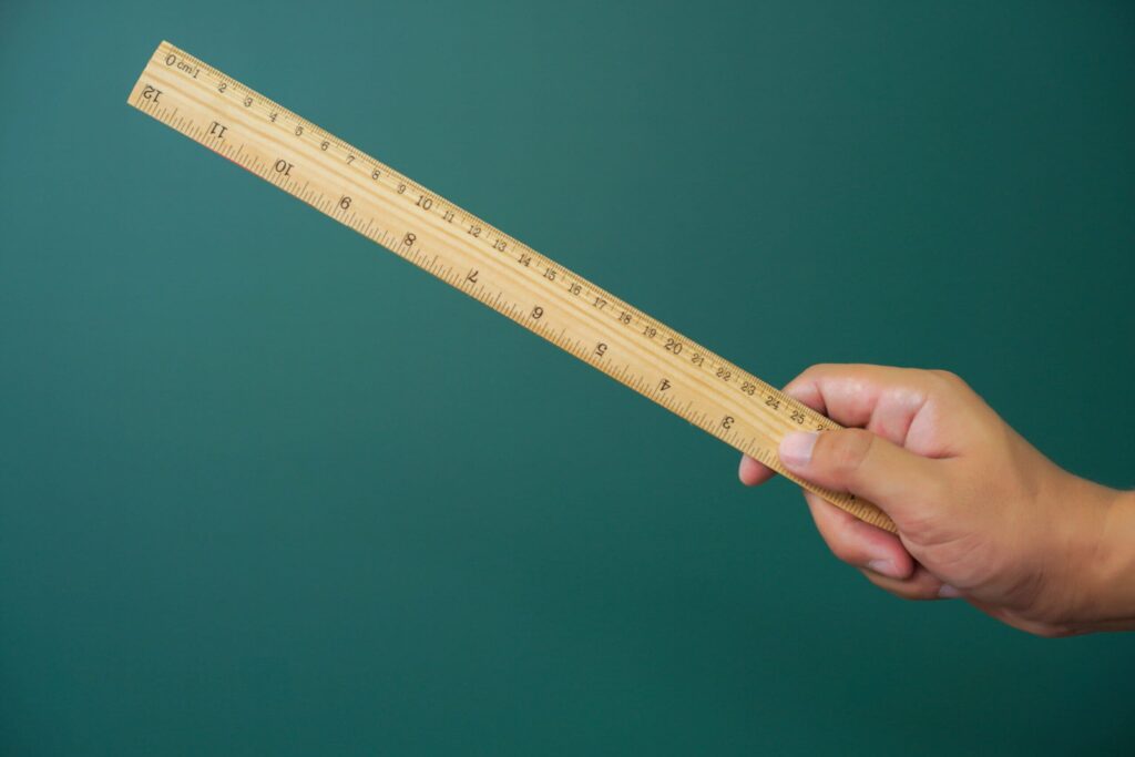 hand holding a ruler