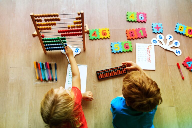 kids playing with an abacus and other math games