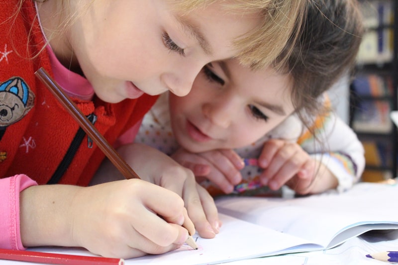 two young children drawing