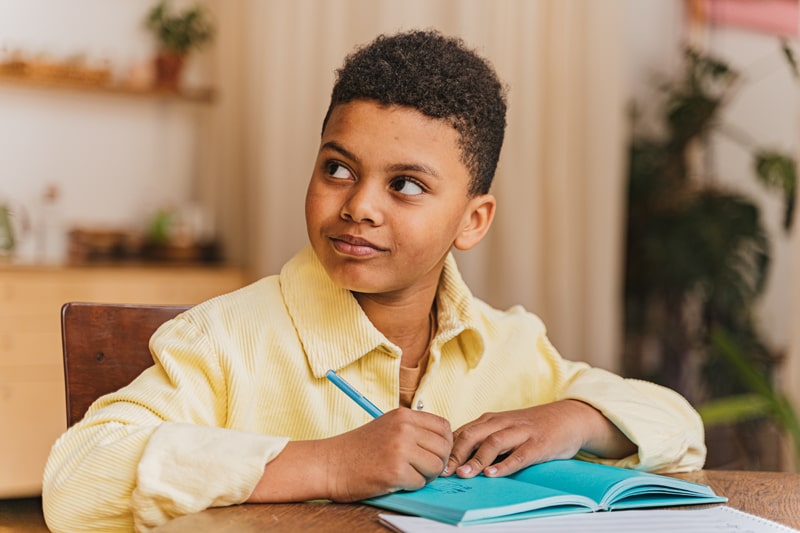 young boy doing homework