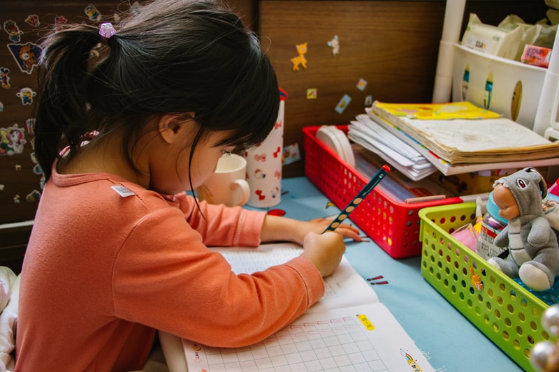 young girl working on homework