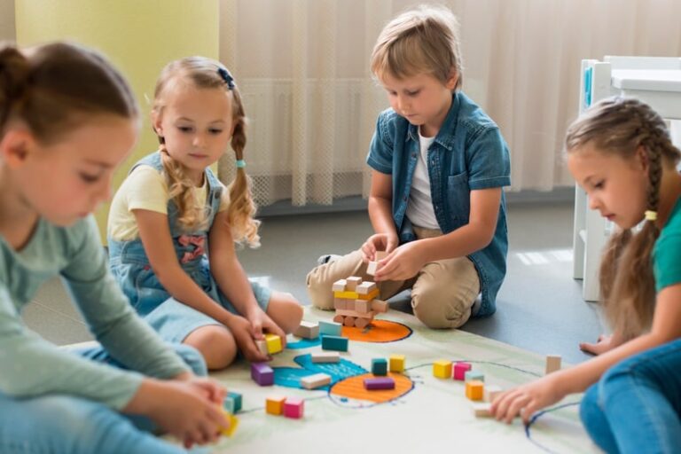 four kids playing with blocks